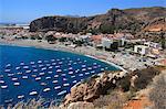 Spain, Andalusia, Costa del Sol, lined up boats in Calahonda Bay.