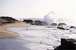 Woman walking on the beach, Western Province, Sri Lanka