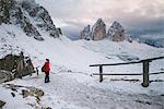 Female hiker looking at view, Tre Cime di Lavaredo area, South Tyrol, Dolomite Alps, Italy