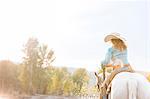 Mature woman riding horse, Missoula, Montana, USA