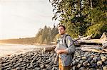 Man gazing from beach in Juan de Fuca Provincial Park, Vancouver Island, British Columbia, Canada