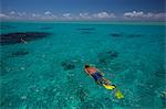 Mature man snorkelling in sea, Ile aux Cerfs, Mauritius