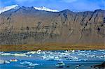 Tourist boat in icebergs in the Jokulsarlon glacial lake in Vatnajokull National Park in southeast Iceland, Polar Regions