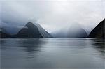 View down rainswept Milford Sound, mountains obscured by cloud, Milford Sound, Fiordland National Park, UNESCO World Heritage Site, Southland, South Island, New Zealand, Pacific