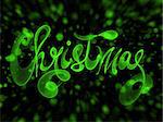 Christmas word lettering written with green fire flame or smoke on blurred bokeh background.