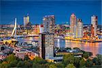 Cityscape image of Rotterdam, Netherlands during twilight blue hour.