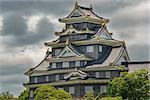 Closeup view of Okayama castle against stormy clouds in Japan