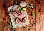 Twu Rib Eye Steak Prepared with Spices for Cooking. View from Above.