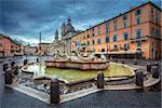 Cityscape image of Novona Square, Rome with Fountain of Neptune during rainy morning.
