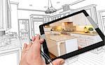 Hand of Architect on Computer Tablet Showing Photo of Kitchen Drawing Behind.