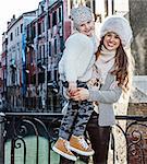 Venice. Off the Beaten Path. smiling trendy mother and daughter travellers in Venice, Italy in the winter