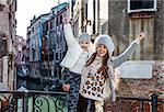 Venice. Off the Beaten Path. smiling modern mother and child travellers in Venice, Italy in the winter rejoicing