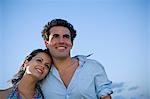 Young couple hugging outdoors