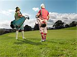 Mature ladies playing golf