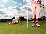 Mature ladies playing golf