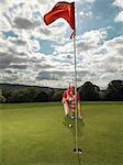 Mature lady playing golf