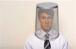 Business man with bin on head