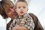 Smiling father with young son