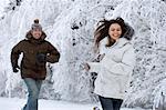 Couple running in the snow.