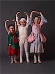 Three little ballerinas posing.