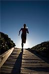 Young Woman Running down BoardWalk