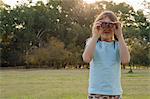 Girl looking through binoculars