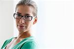 Woman with glasses looking at camera