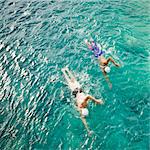 Men swimming in sea