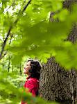 Woman Resting On Tree Close-Up