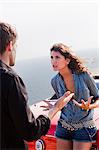 couple arguing next to car