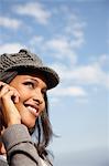 Woman smiling using mobile outdoors