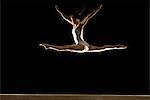 gymnast jumping on beam