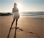 woman at the beach looking into distance