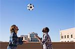 friends on roof top heading football