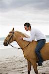 Man riding horse on the beach