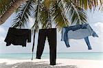 Business clothes drying on line on beach