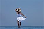 Woman standing at edge of infinity pool