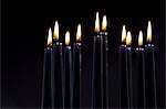 Close up of lit black candles