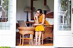 Woman using laptop in living room