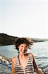 Smiling woman playing on beach