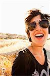 Smiling woman standing in wheatfield