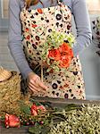 Florist tying bouquet in shop