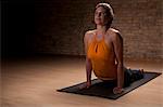 Woman practicing yoga on mat