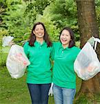 Gardeners picking up trash in park