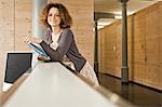 Businesswoman on counter in office