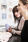 Businesswoman with thread in office