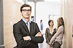 Businessman standing in hallway