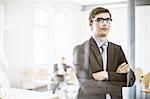 Businessman standing in hallway