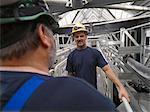 Workers talking in factory