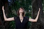 Woman standing in forest